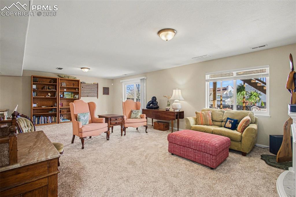 Image 28 of 42: View of carpeted living room