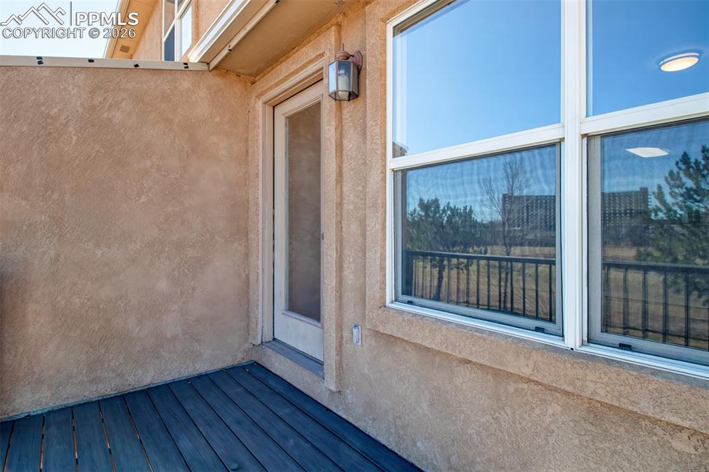 Image 10 of 33: Walk out deck off living room