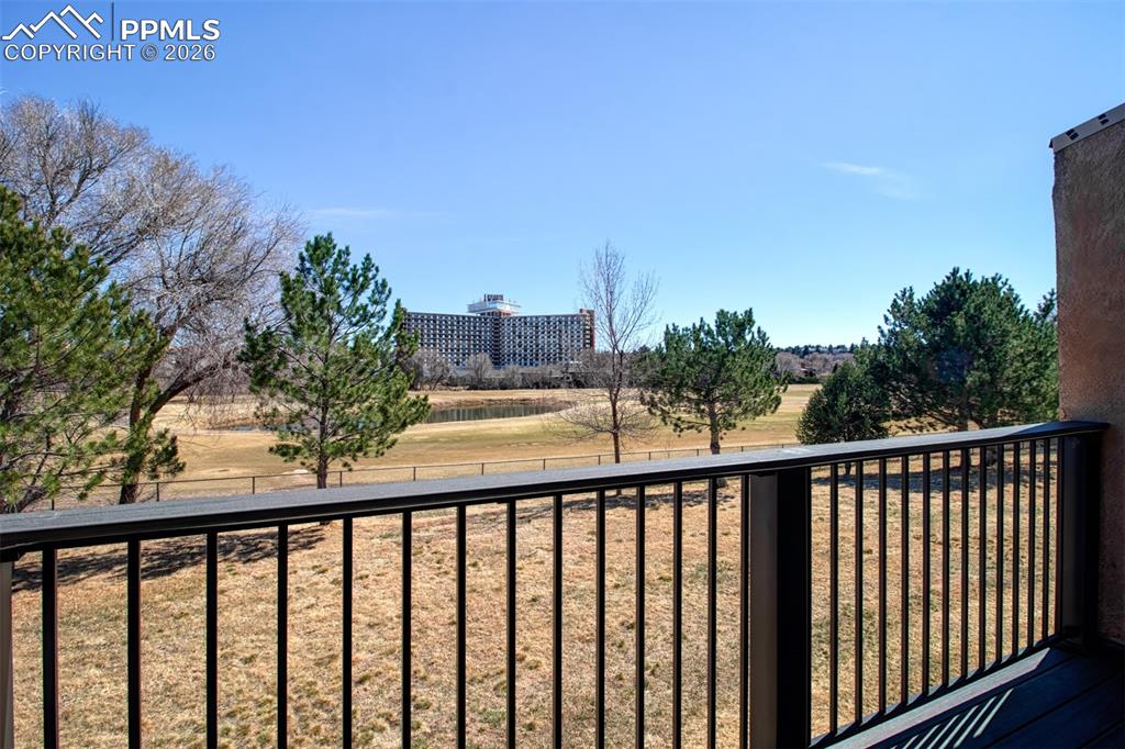 Image 11 of 33: Deck off living room looking over the golf course