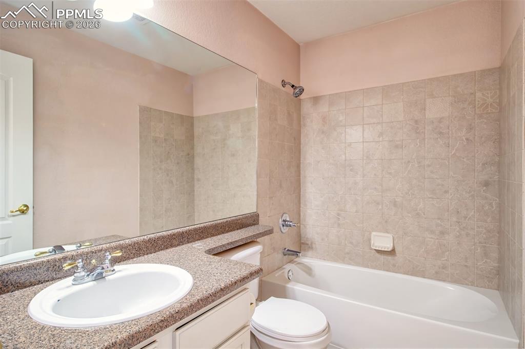 Image 15 of 33: Full bathroom between primary bedroom and bedroom 2