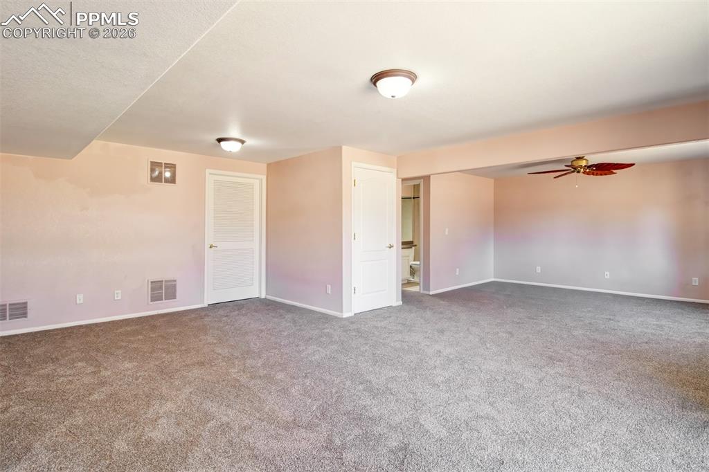 Image 20 of 33: Recreation room in basement with walk out to covered patio