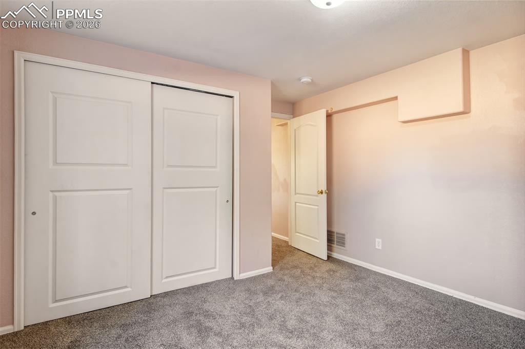 Image 22 of 33: Bedroom 3 in basement 