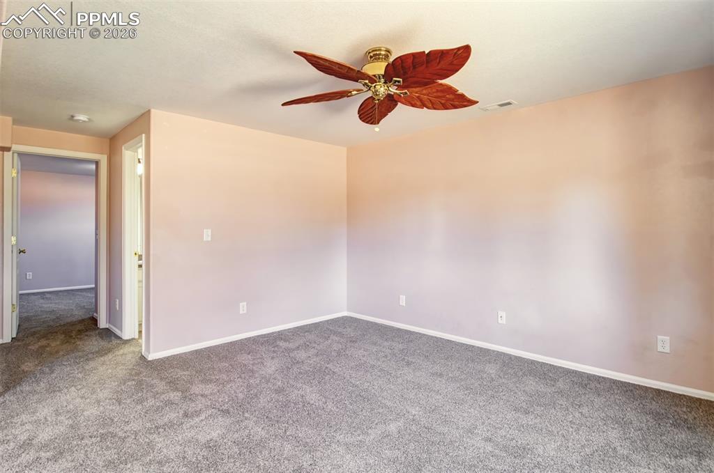 Image 25 of 33: Recreation room in basement with walk out to covered patio