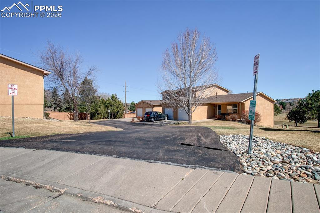 Image 30 of 33: Driveway to townhome