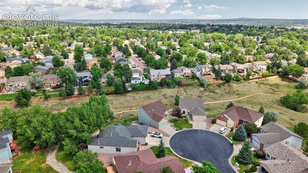 Image 15 of 50: Residential neighborhood featuring mature trees and varied architectural st