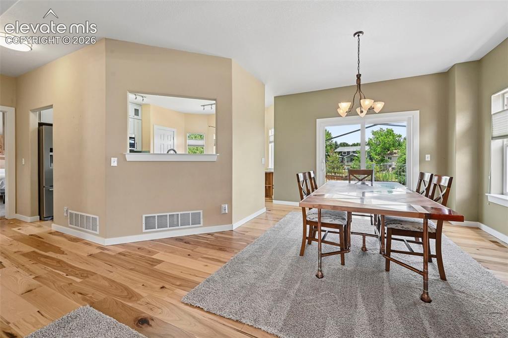 Image 20 of 50: Hardwood-style flooring throughout