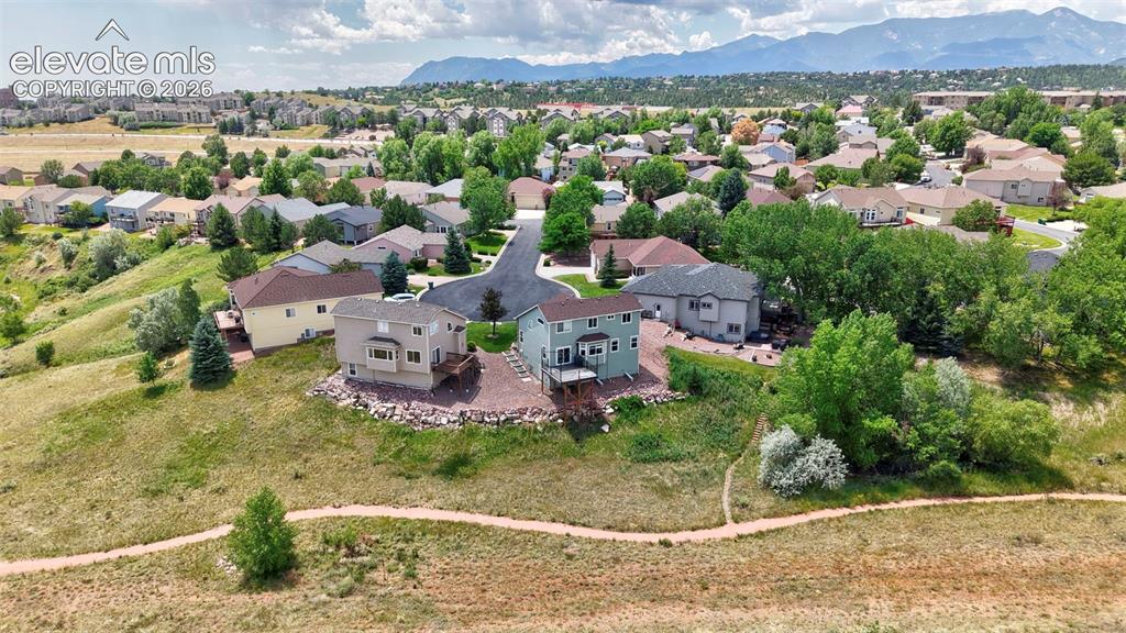 Image 8 of 50: Aerial perspective showcasing a residential neighborhood with varied archit