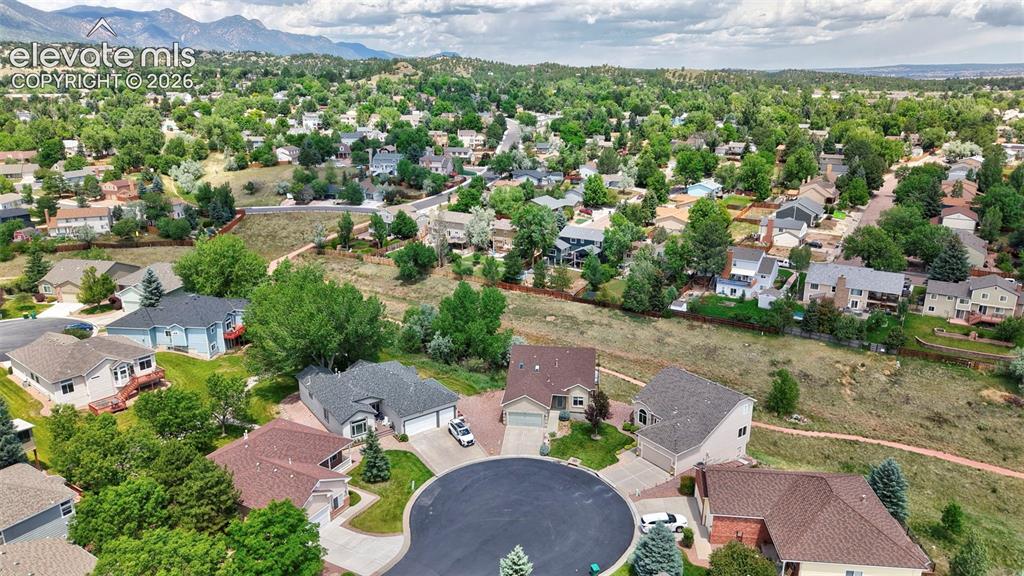 Image 9 of 50: Aerial perspective showcasing a residential community with varied architect