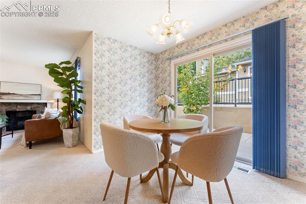 Image 11 of 30: Dining room right off the kitchen with a walkout to the back patio