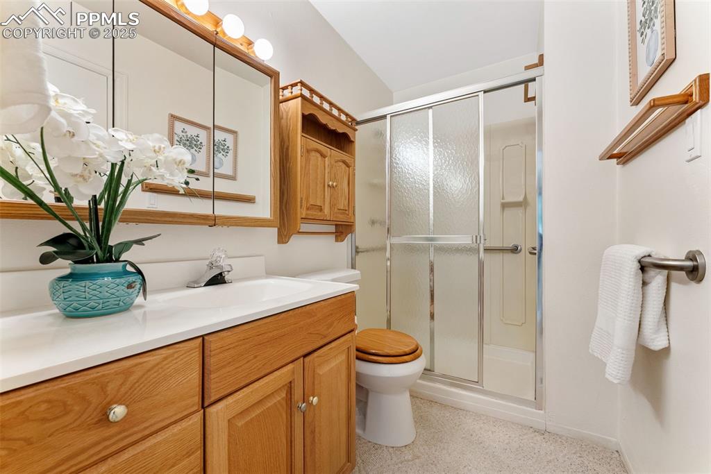 Image 21 of 30: Bathroom featuring vanity and a walk-in shower