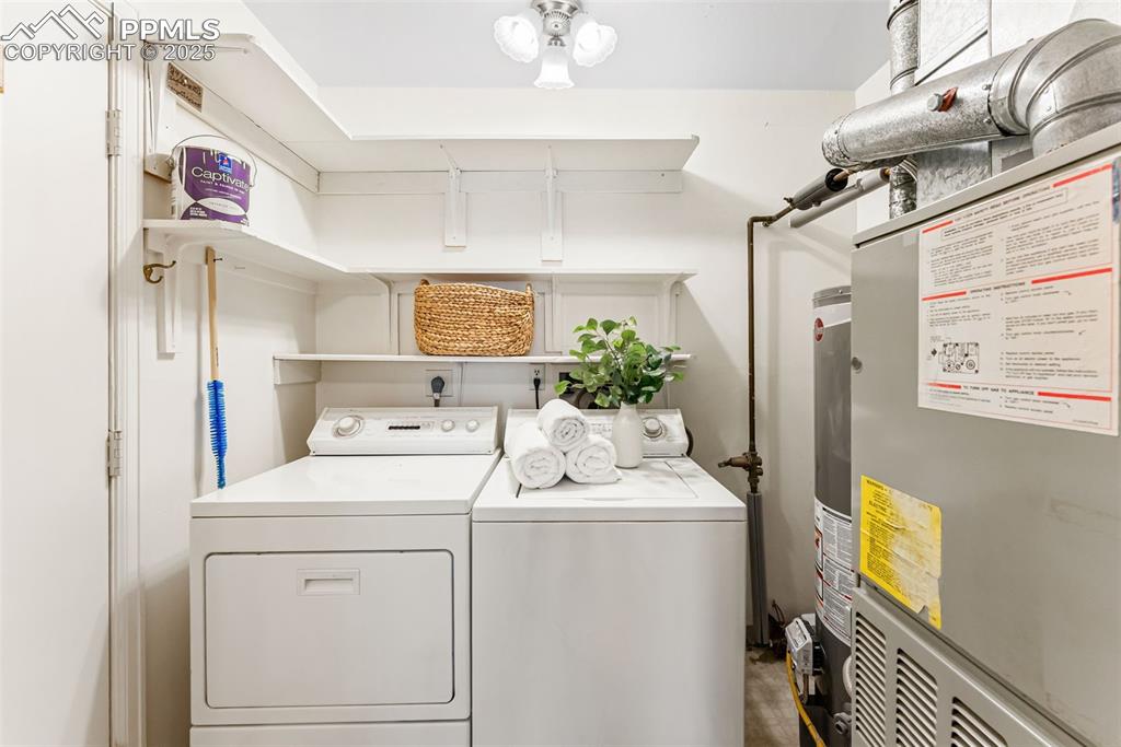 Image 23 of 30: In-unit laundry right off the entry from the carport