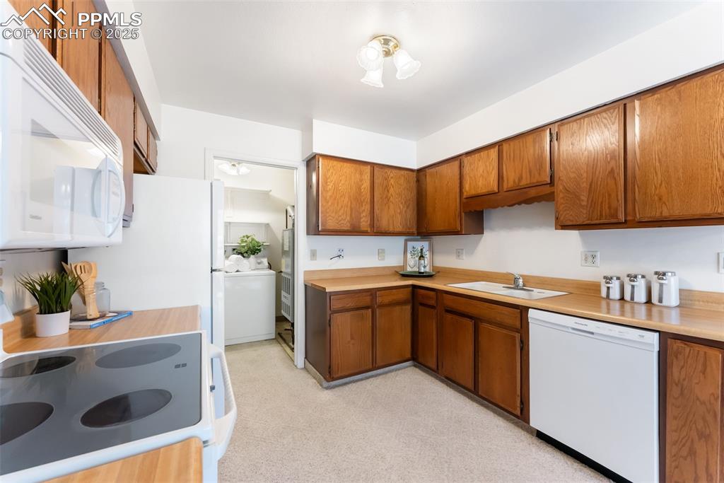 Image 6 of 30: Full kitchen with plenty of counter and cabinet space