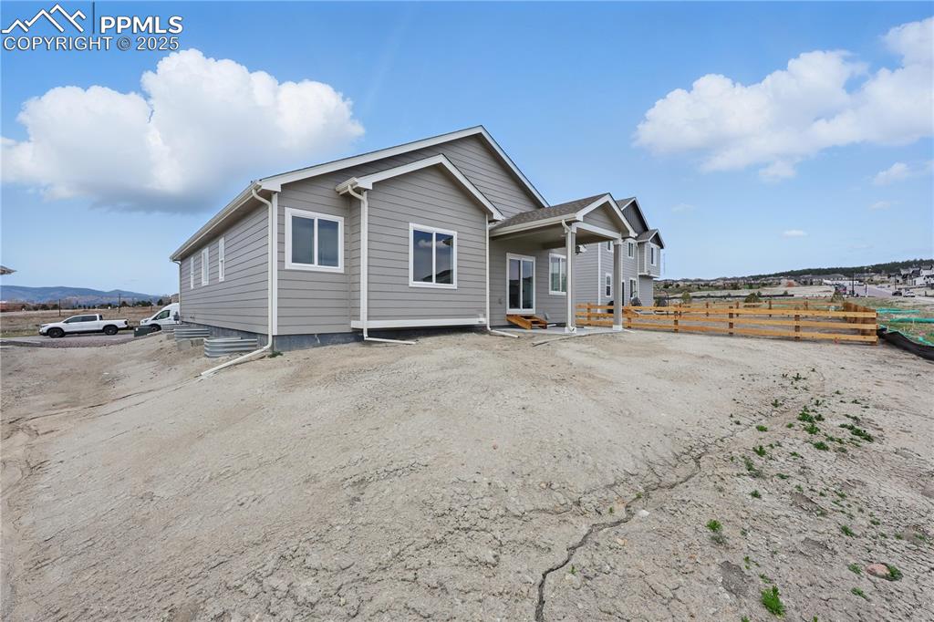 Image 4 of 35: Rear view of property with fence