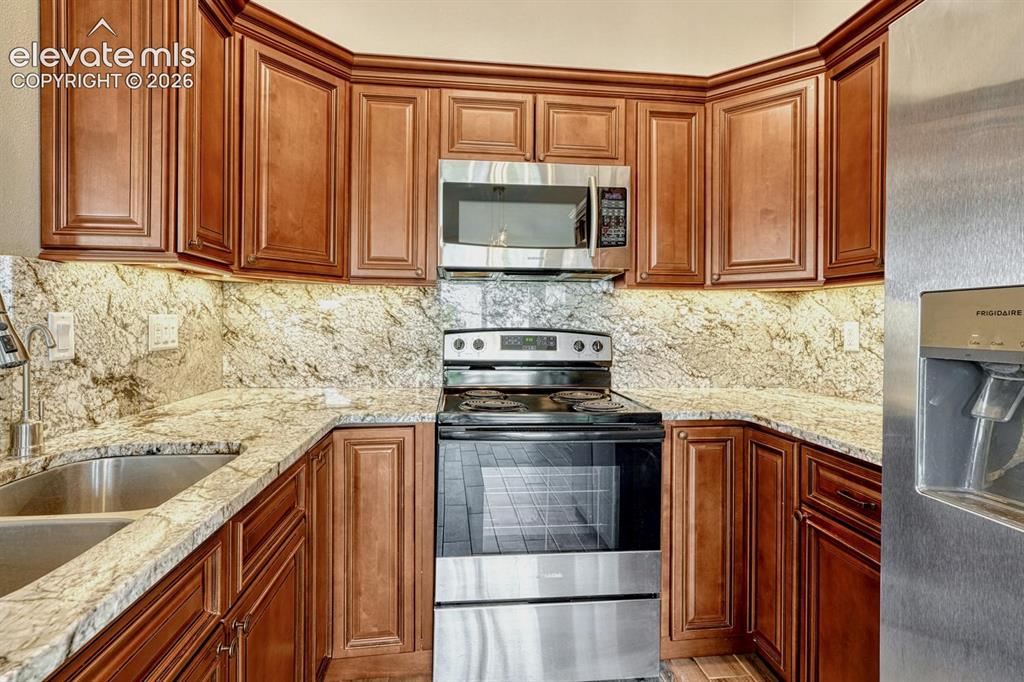 Image 15 of 50: Note the under-cabinet lighting and crown lighting