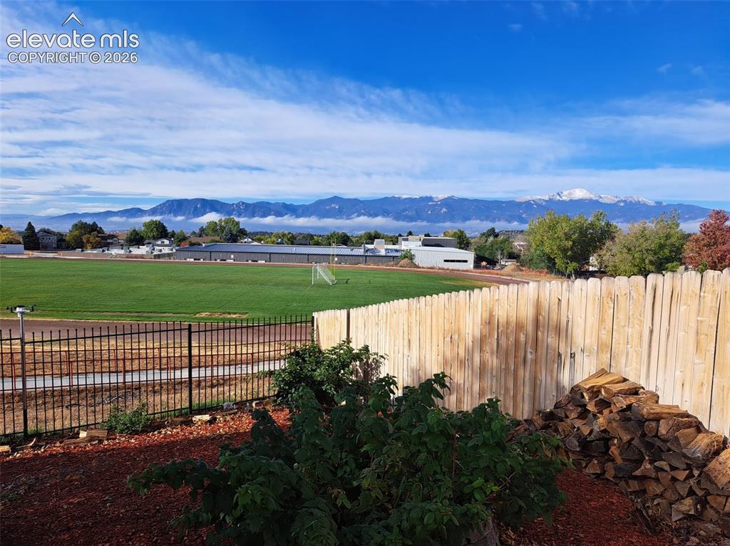 Image 3 of 50: Back yard with Pikes Peak and Front Range views
