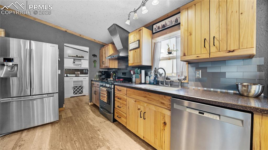 Image 13 of 35: Upgraded cabinets, propane range