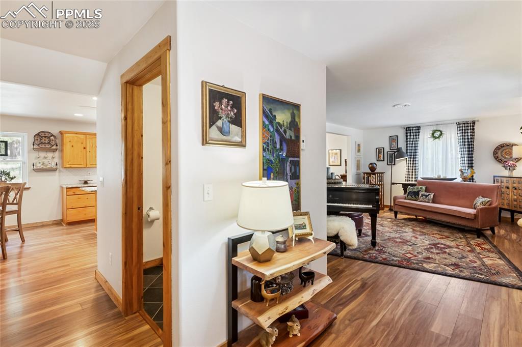 Image 22 of 50: Living area featuring light wood-style floors