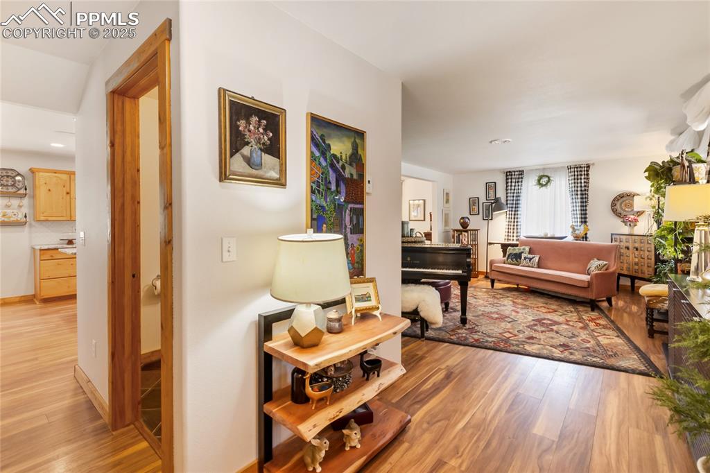 Image 3 of 50: Living room featuring light wood-type flooring and recessed lighting