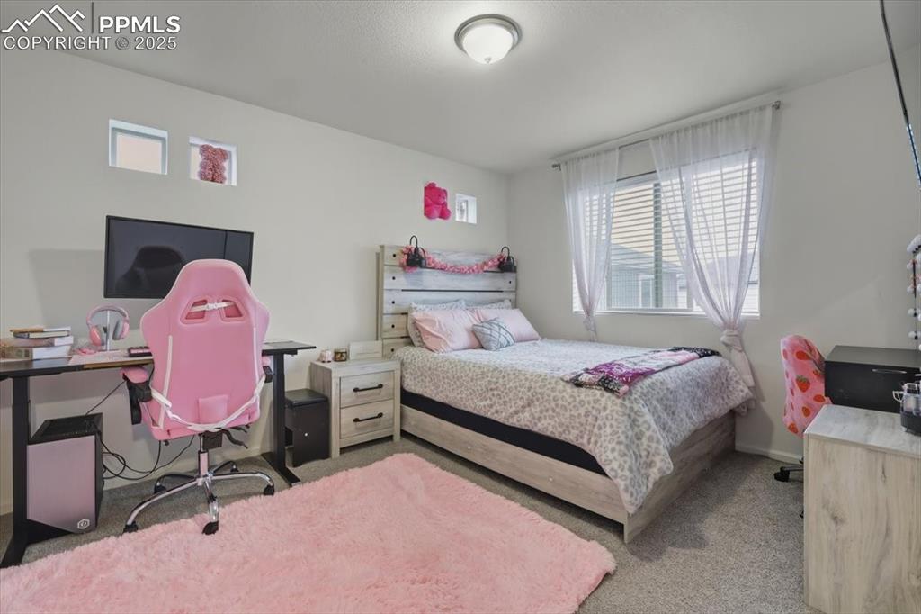 Image 16 of 35: Upper level 2nd bedroom.