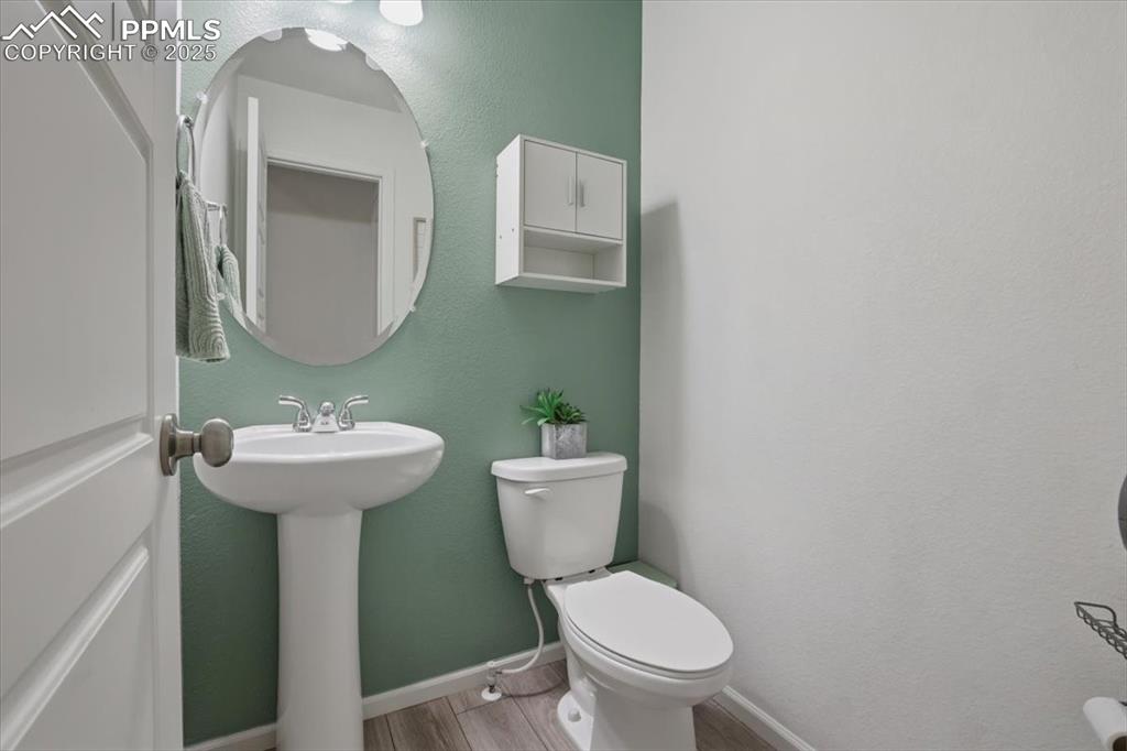 Image 22 of 35: Main level guest bathroom.