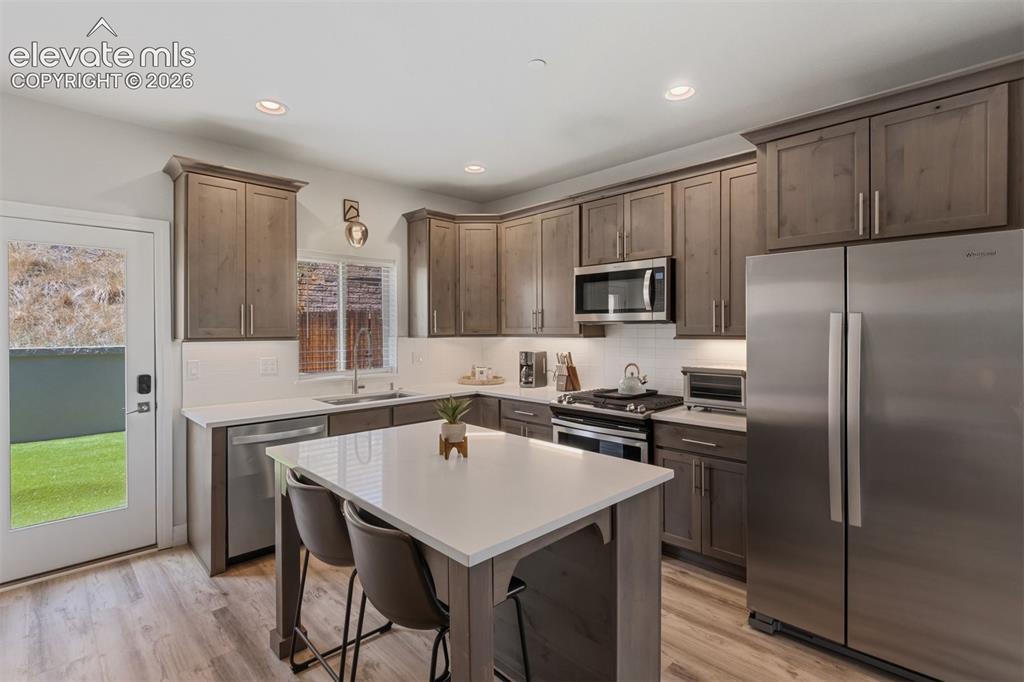 Image 10 of 42: Kitchen with walkout access to back yard