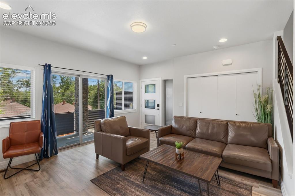 Image 2 of 42: Living room with walkout access to deck