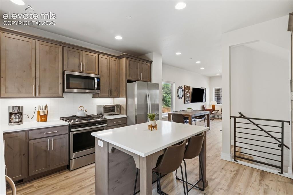 Image 3 of 42: Kitchen with Quartz counters