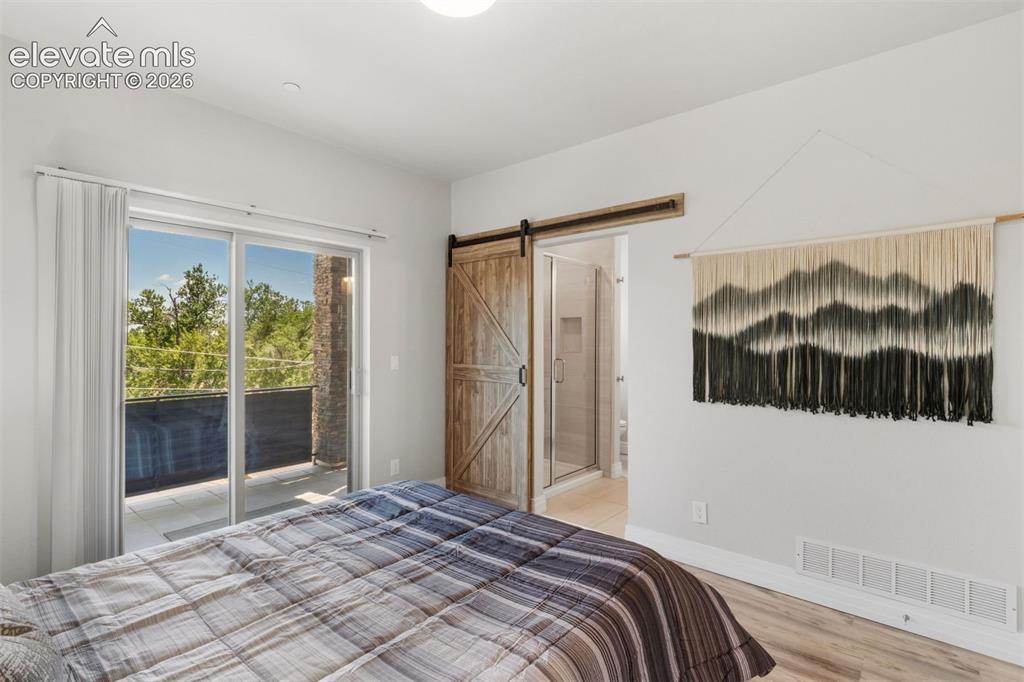 Image 4 of 42: Primary bedroom with ensuite bath and walk in closet