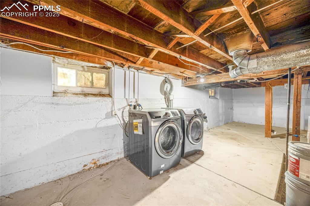 Image 20 of 28: Below grade area with separate washer and dryer