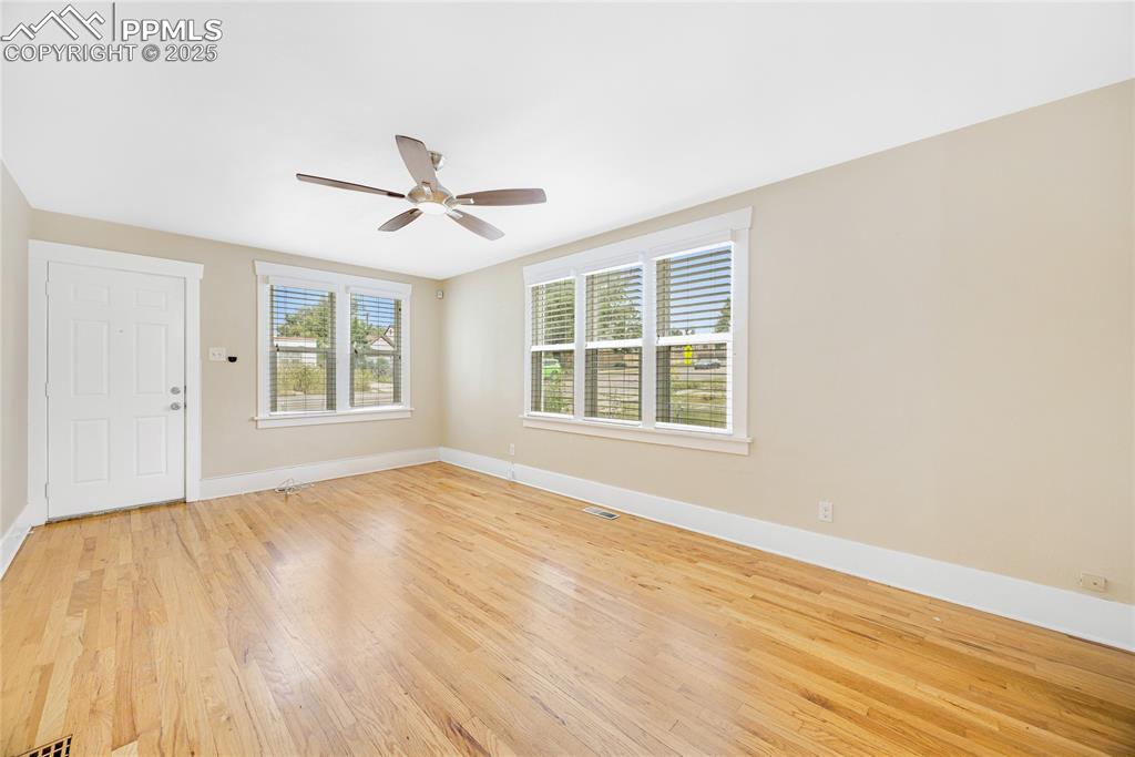 Image 8 of 28: Spare room featuring light wood-type flooring, healthy amount of natural li