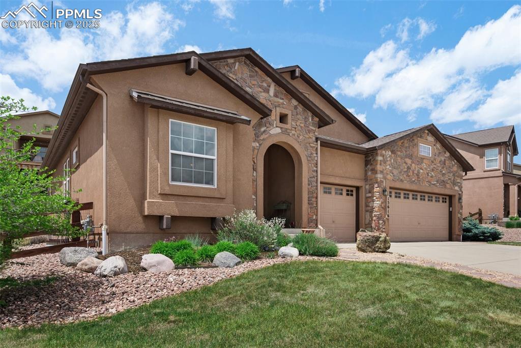 Image 3 of 50: Beautiful home with south-facing driveway