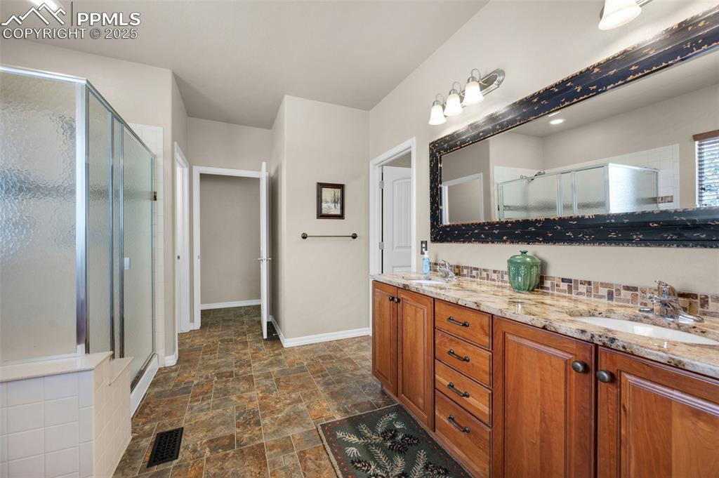 Image 31 of 50: Master bathroom -walk-in shower, walk-in closet, direct access to laundry