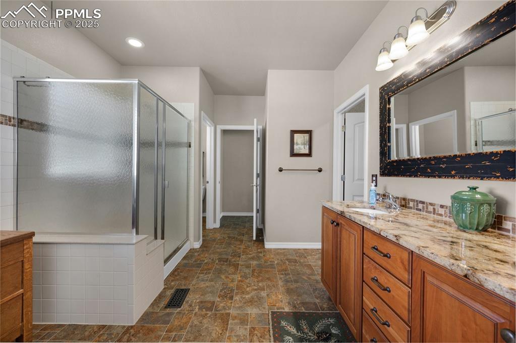 Image 32 of 50: Master bathroom -walk-in shower, walk-in closet, direct access to laundry
