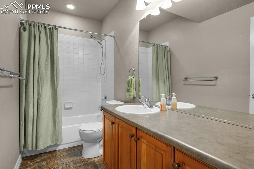Image 39 of 50: Full bath ion basement, serving both bedrooms there