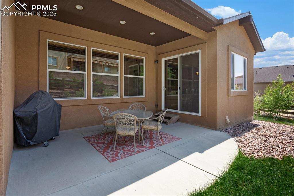 Image 46 of 50: Covered back patio - cool shade in the summer!