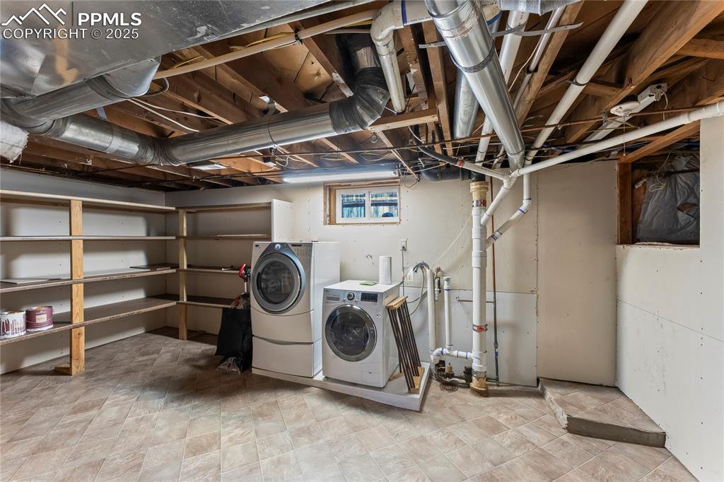 Image 33 of 42: Downstairs laundry (Upstairs laundry hookup in hallway)