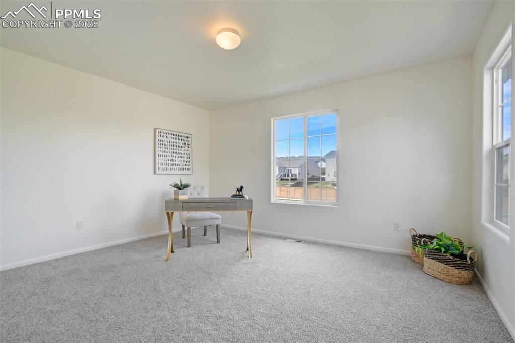 Image 14 of 38: A second bedroom on upper level with great windows!