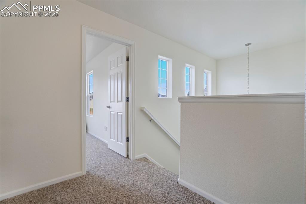 Image 17 of 38: top of stair landing, very spacious area