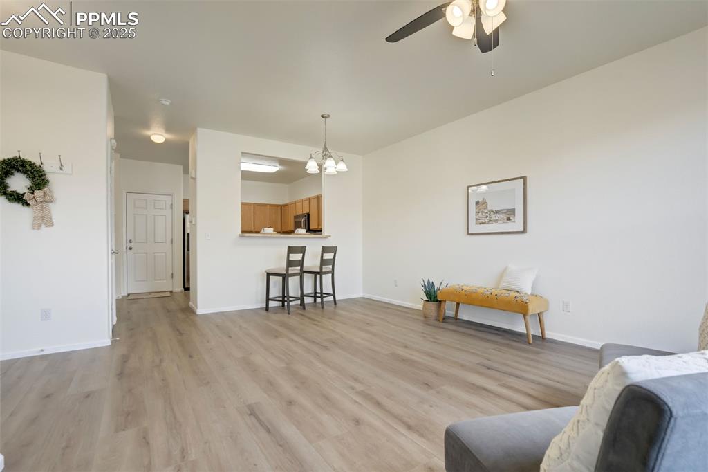 Image 7 of 38: Open floor plan with access to garage access off kitchen