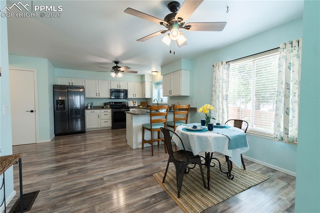 Image 10 of 48: Dining Room and Kitchen From Living Room