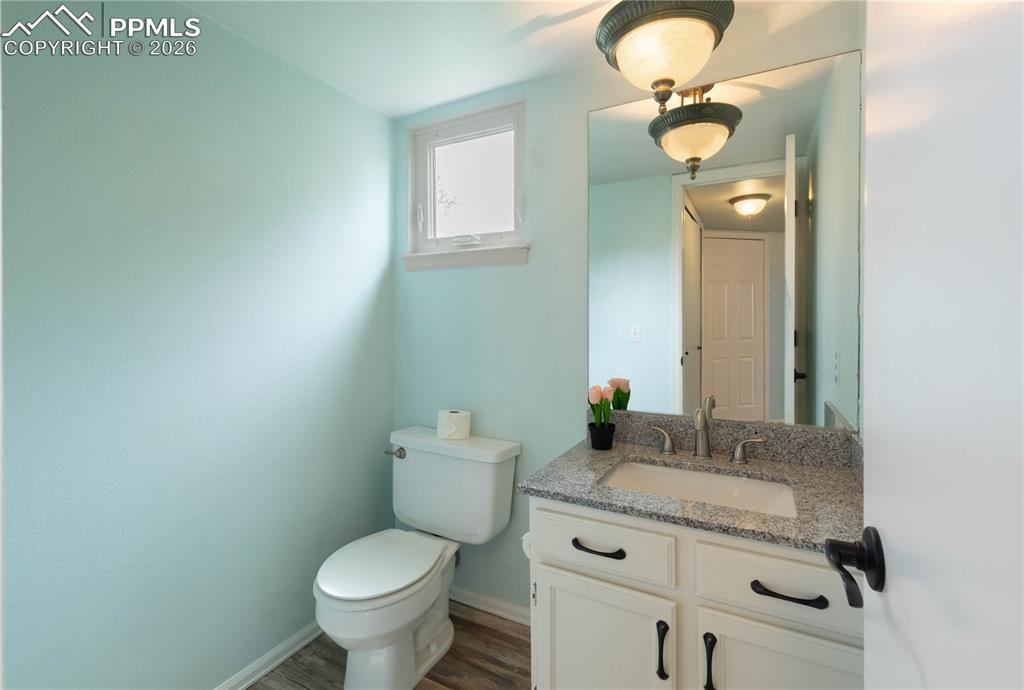 Image 16 of 48: Powder Room off Kitchen