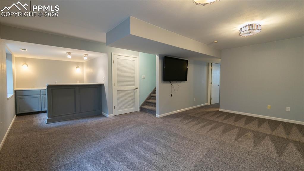 Image 20 of 48: Basement Living Room and Wet Bar