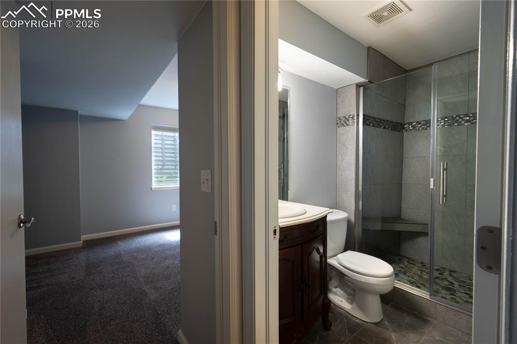 Image 22 of 48: Basement Hall to Bathroom and Bedroom