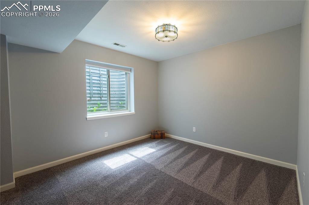 Image 23 of 48: Basement Bedroom