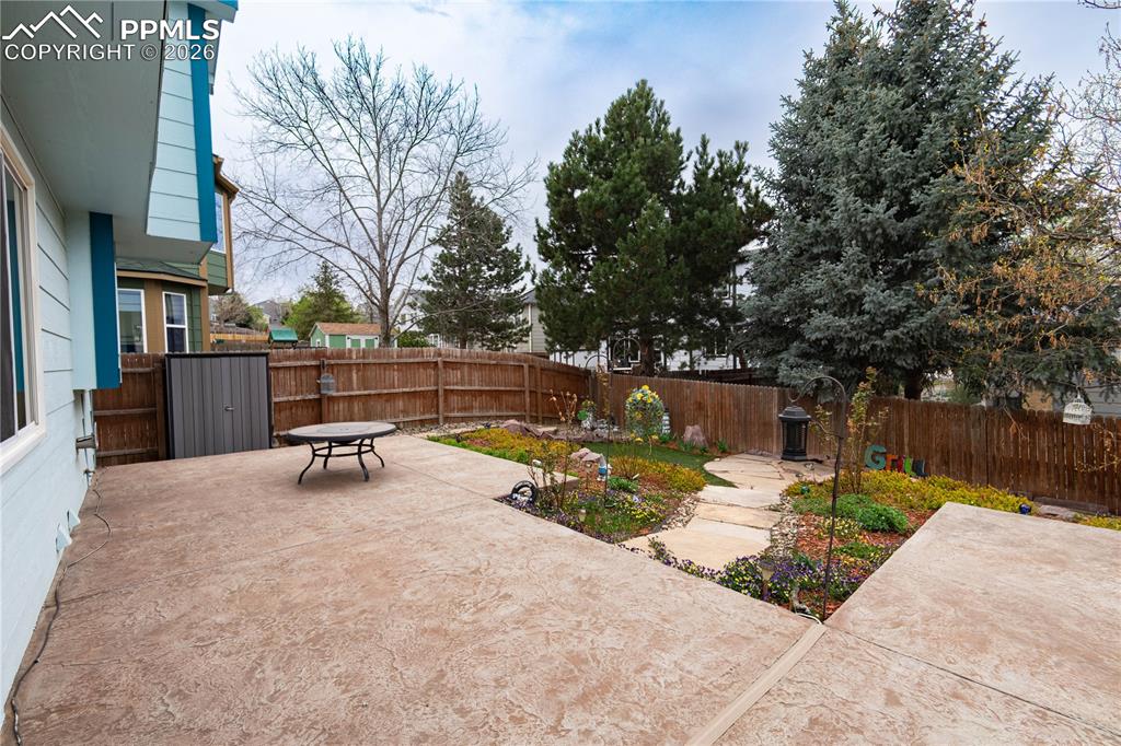 Image 29 of 48: Extended Patio in Backyard