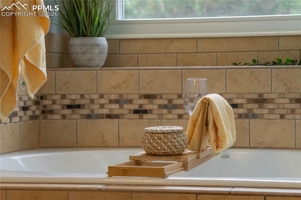 Image 35 of 48: Primary Soaking Tub with Shelf
