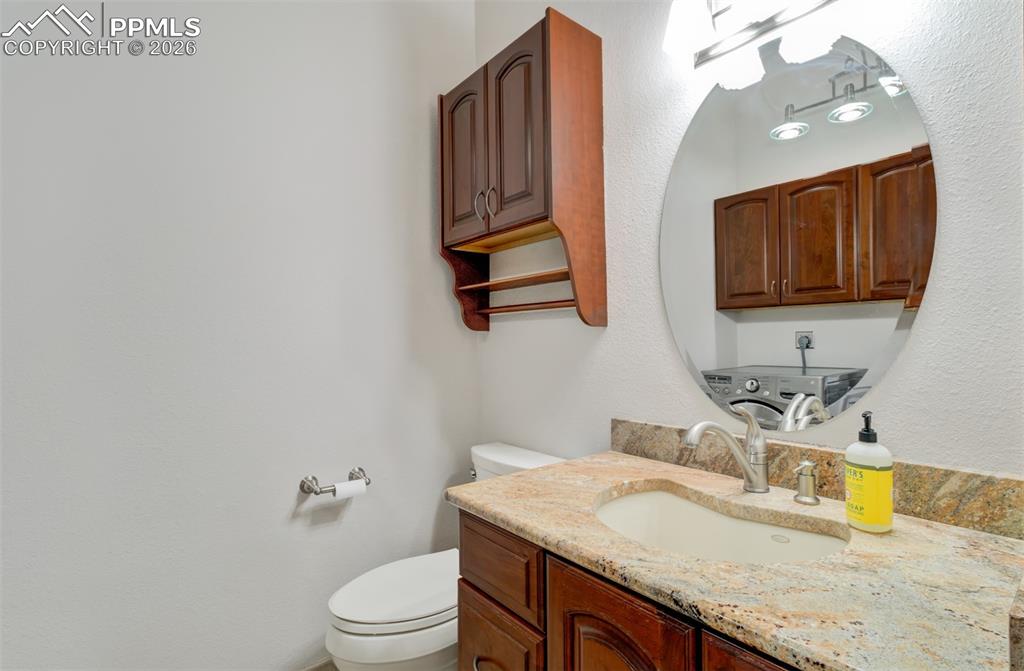 Image 14 of 45: Laundry/Half bathroom on the main level