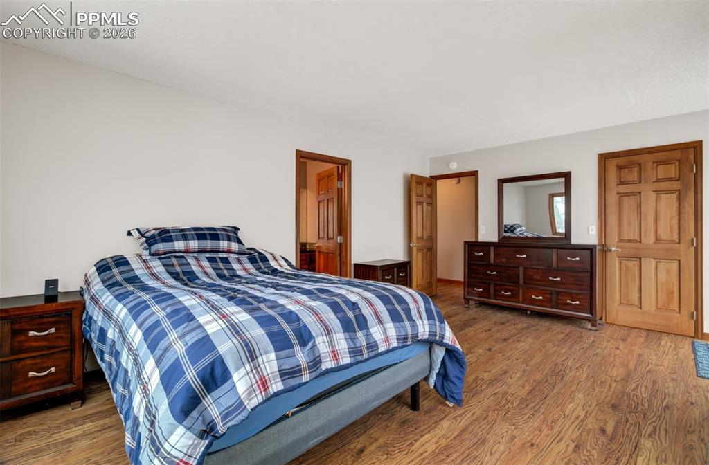Image 15 of 45: Primary bedroom on the upper level with an en suite bathroom, walk in close