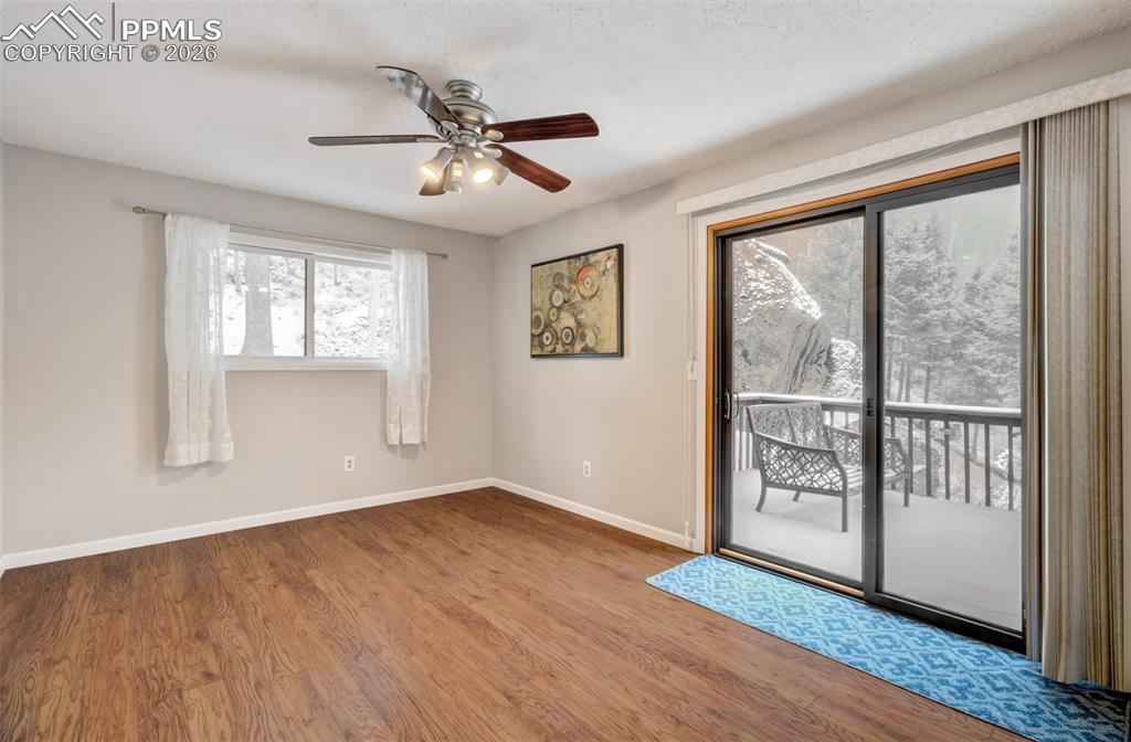 Image 21 of 45: Bedroom 2 with a walk out deck, en suite full bathroom and huge walk in clo