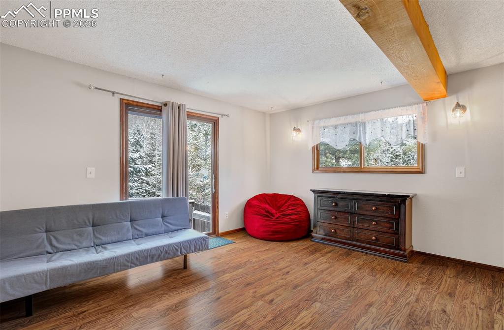 Image 28 of 45: Bedroom 3 highlighting the walk out to the dog run